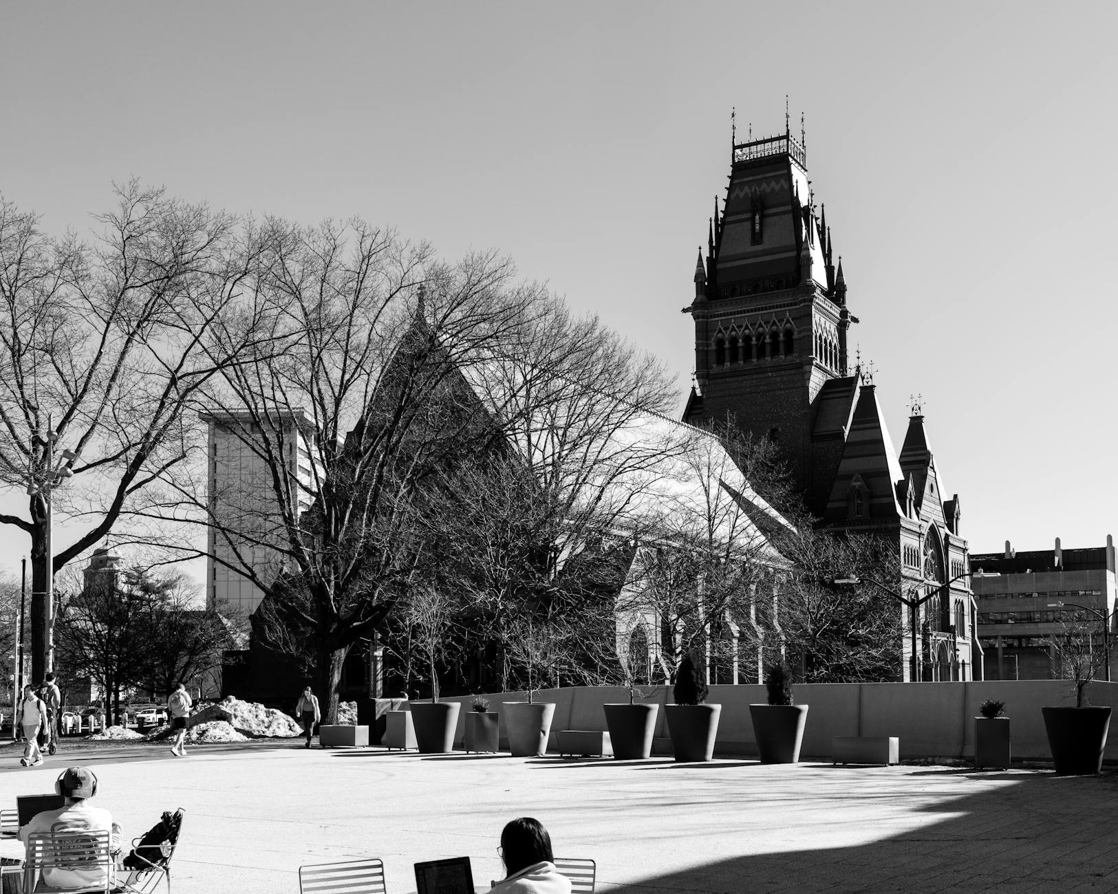 Students walk near Harvard Yard as the university faces a federal lawsuit over its handling of antisemitism allegations.