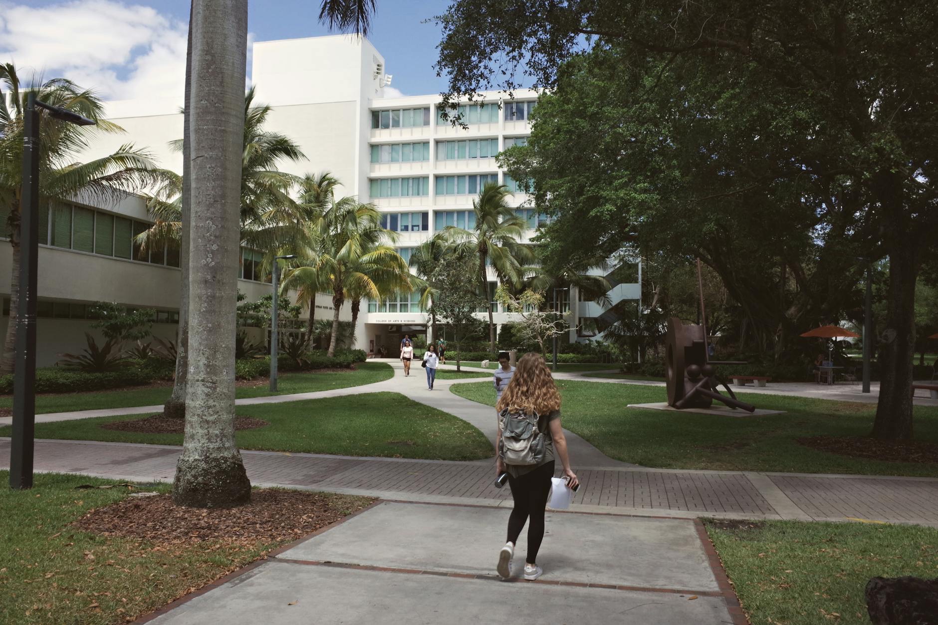 College students review financial aid and student loan documents on a university campus in the United States.