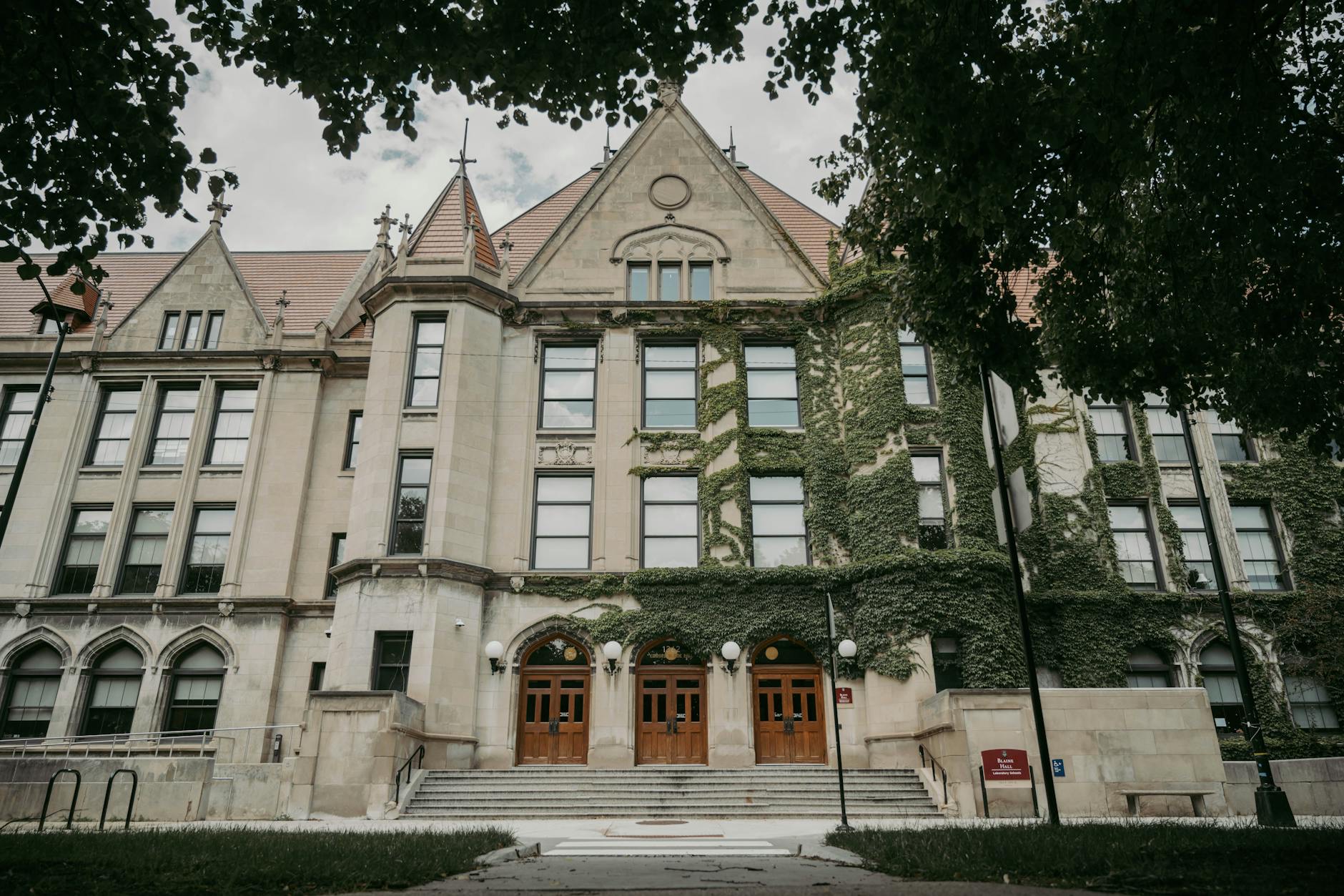 Prospective law students review enrollment and financial aid documents on a U.S. university campus.