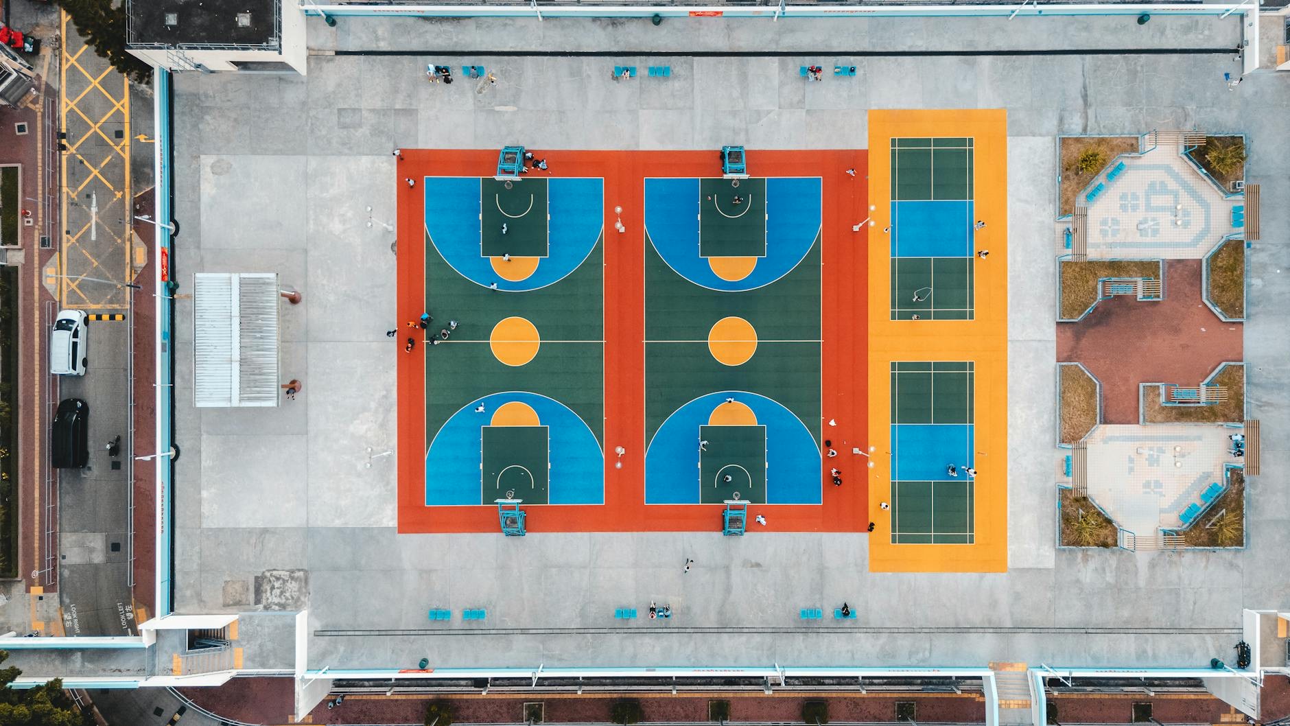 Duke basketball players and coaches gather on a college court during practice as NCAA eligibility questions surround international recruits.