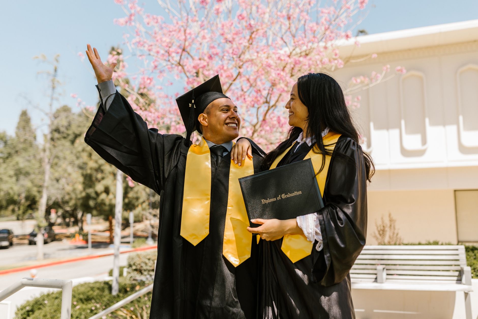 Graduate students walk across a university campus as new federal loan caps reshape how advanced degrees are financed.