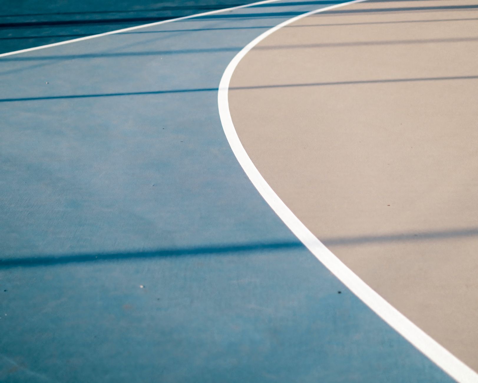 An NBA basketball game takes place in a packed arena as the league introduces new restrictions on player proposition bets and high-payout sports wagers.